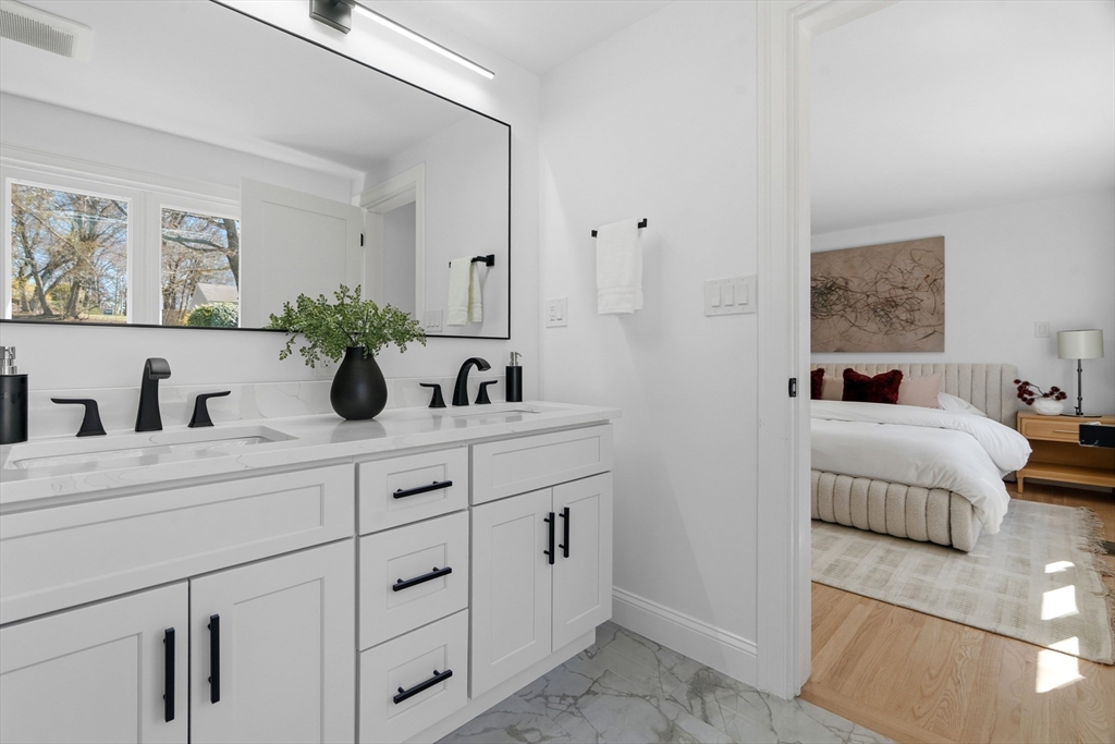 171 Shaw Road Brookline, MA 02467 - Photo 20 of 42 a spacious bathroom with sinks and mirror