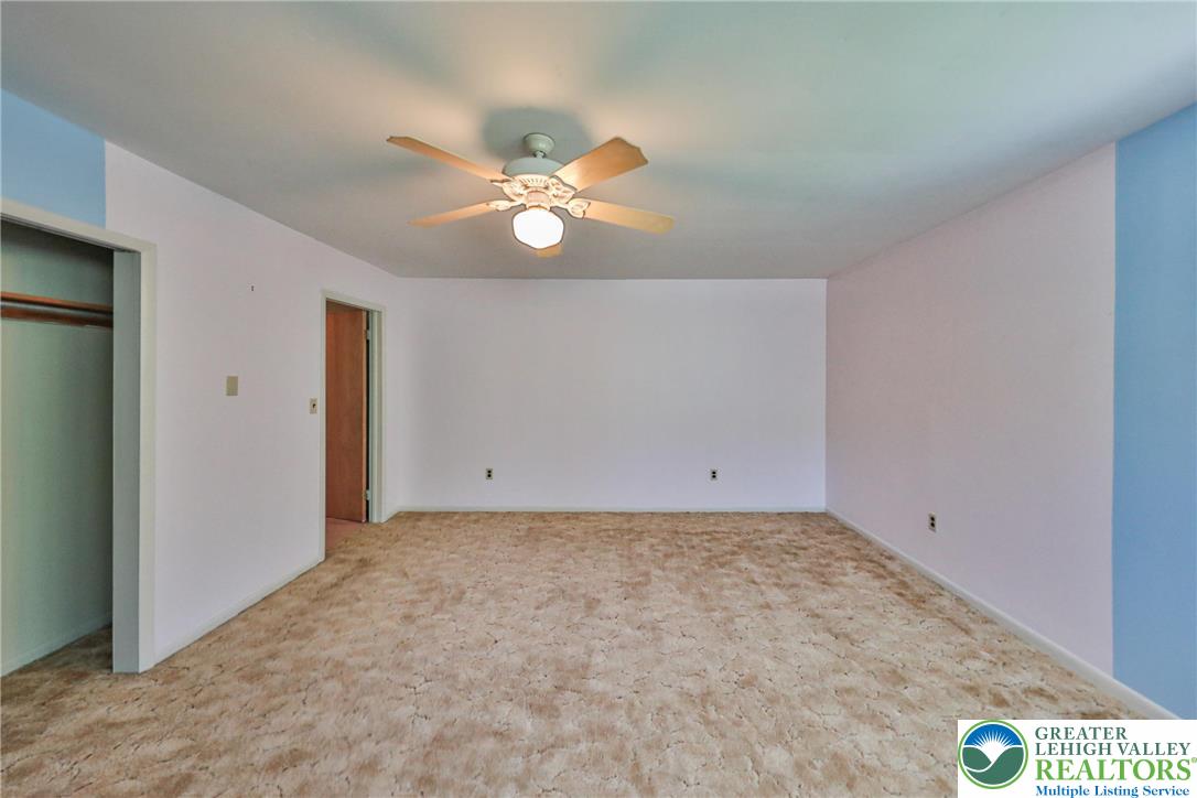 331 Cranberry Creek Road Cresco, PA 18326 - Photo 52 of 95 A spacious bedroom features soft carpet and a convenient ceiling fan for ultimate comfort.