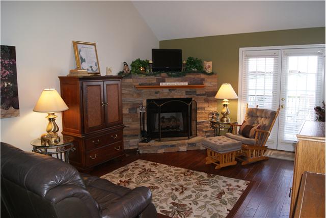 518 Dorris Road Portland, TN 37148 - Photo 12 of 20 The living room area has a gas fireplace with a beautiful stone hearth. It will become your favorite spot to relax or entertain.
