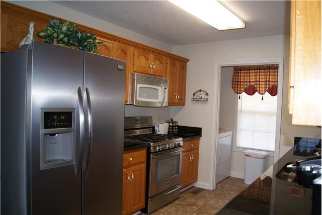 518 Dorris Road Portland, TN 37148 - Photo 4 of 20 The extra wide galley style kitchen will greatly be appreciated with its granite counter tops and plentiful cabinets.