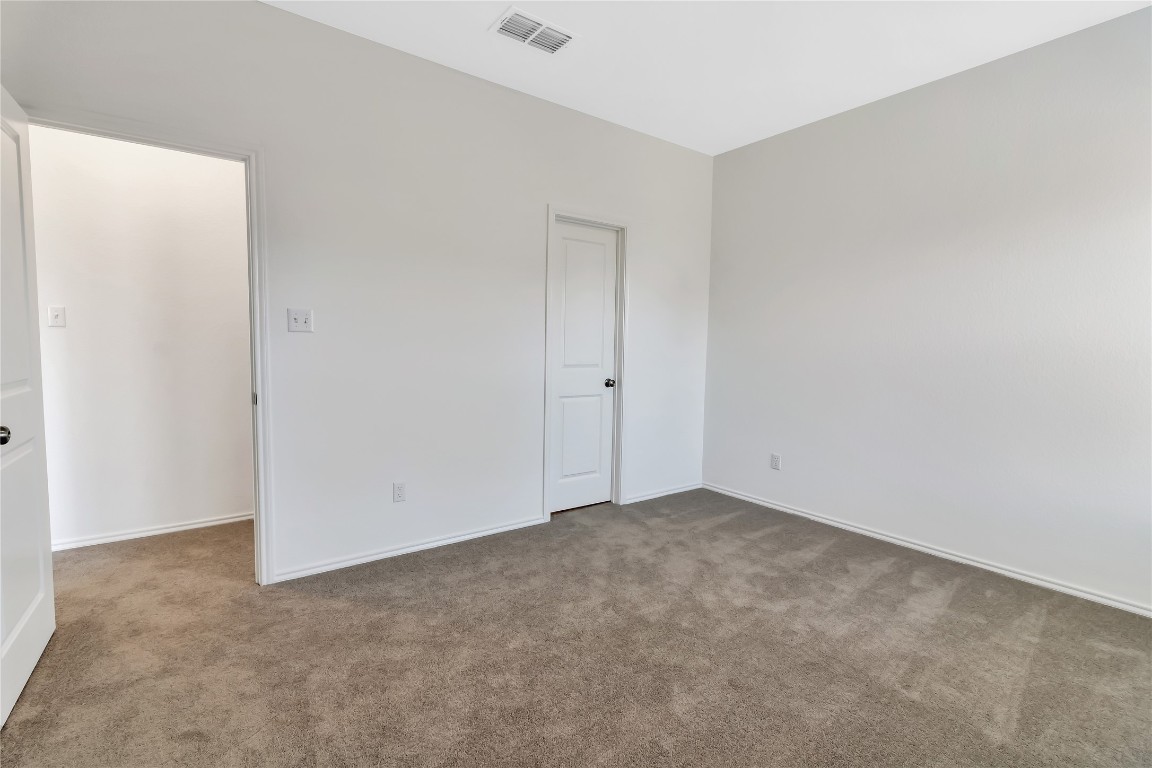 160 The Bad Way Jarrell, TX 76537 - Photo 14 of 33 Unfurnished bedroom with carpet and baseboards
