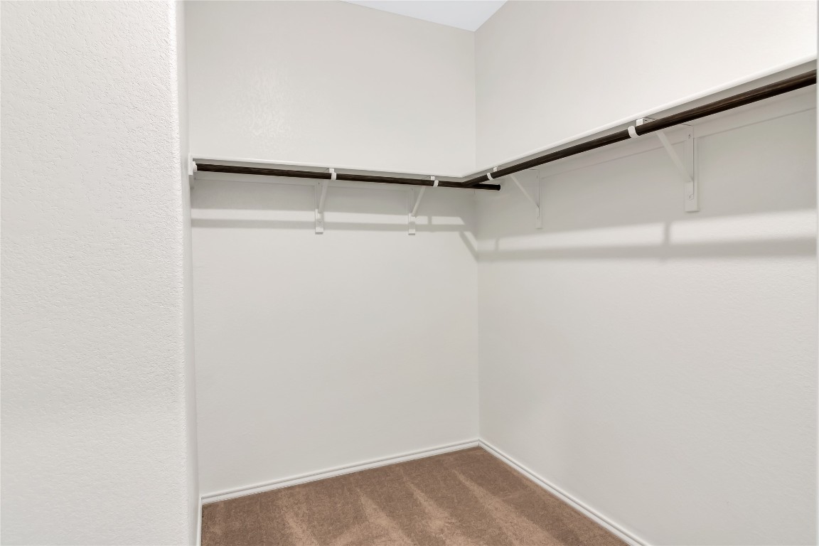 160 The Bad Way Jarrell, TX 76537 - Photo 17 of 33 Spacious closet with dark carpet