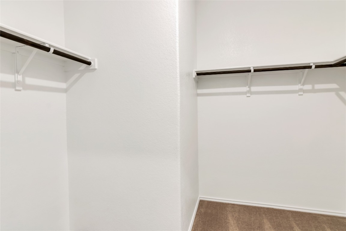 160 The Bad Way Jarrell, TX 76537 - Photo 18 of 33 Spacious closet with dark colored carpet