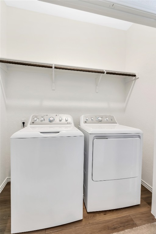 160 The Bad Way Jarrell, TX 76537 - Photo 20 of 33 Laundry room featuring dark wood finished floors and washer and dryer