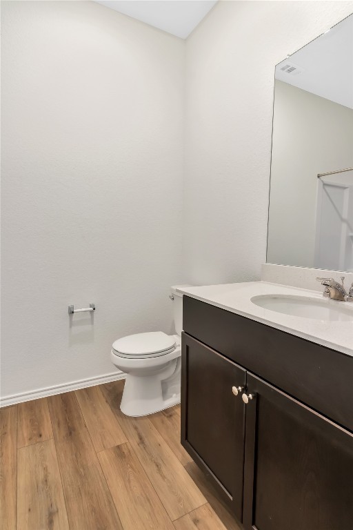 160 The Bad Way Jarrell, TX 76537 - Photo 23 of 33 Half bathroom with vanity and light wood finished floors