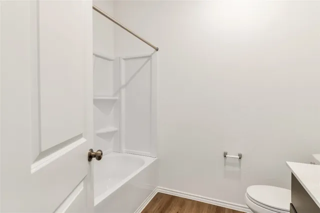 a bathroom with a sink and toilet