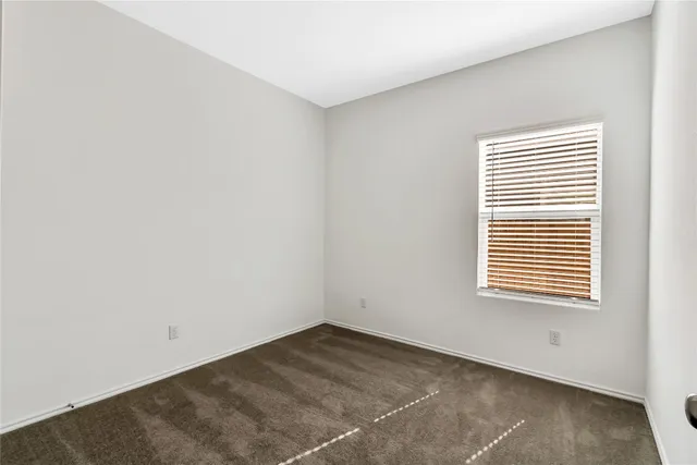 a view of a room that has a window in it