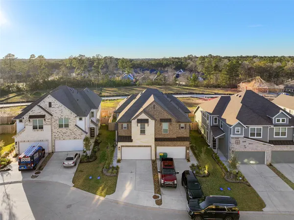 an aerial view of a house with a garden