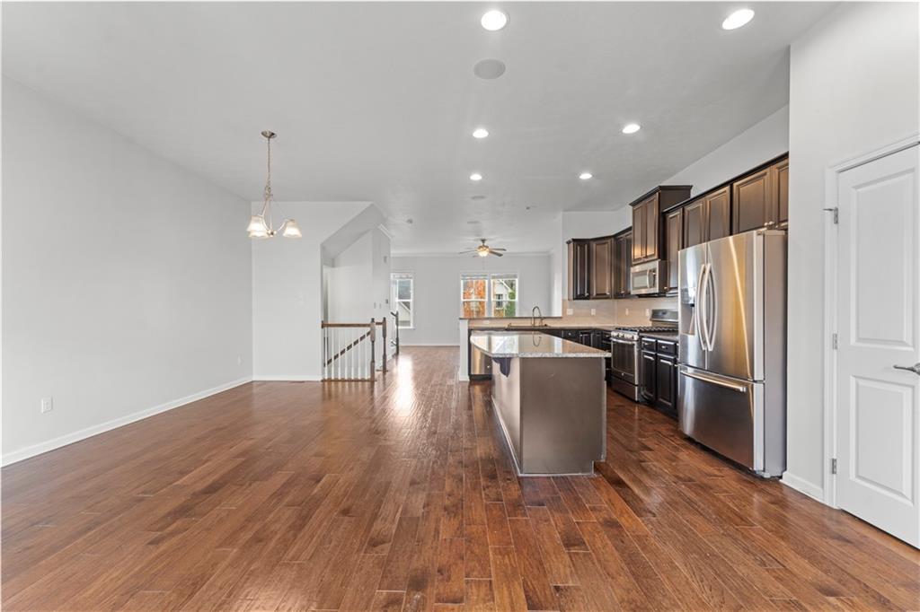 818 Oneida Circle Mars, PA 16046 - Photo 14 of 45 a kitchen with a refrigerator and a wooden floor