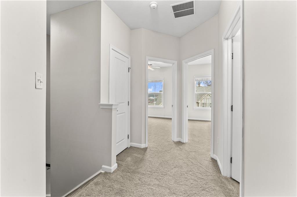 818 Oneida Circle Mars, PA 16046 - Photo 21 of 45 an empty room with white cabinet and mirrors