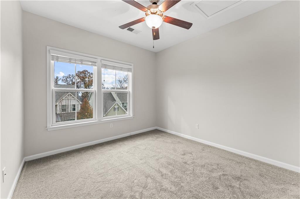 818 Oneida Circle Mars, PA 16046 - Photo 22 of 45 an empty room with chandelier fan and windows