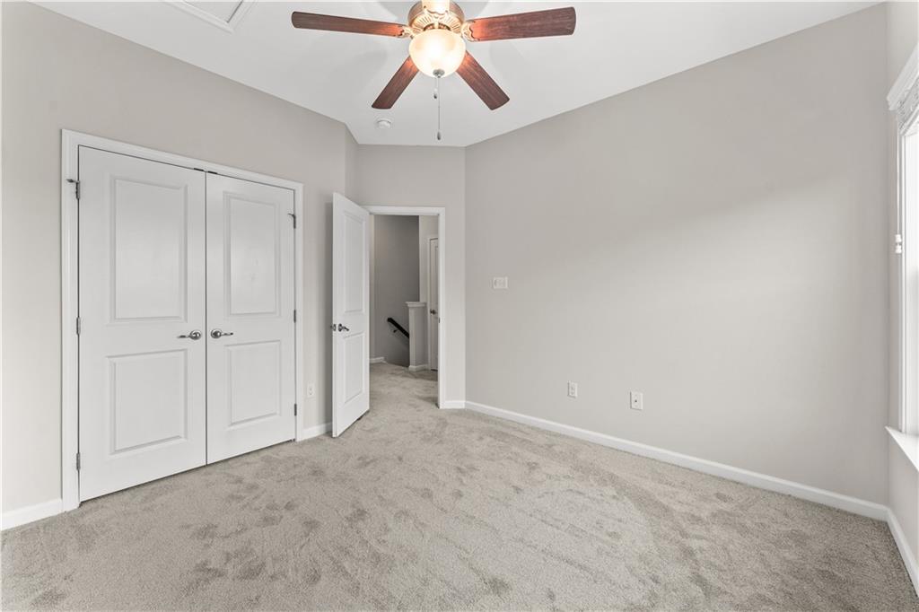 818 Oneida Circle Mars, PA 16046 - Photo 23 of 45 an empty room with chandelier fan
