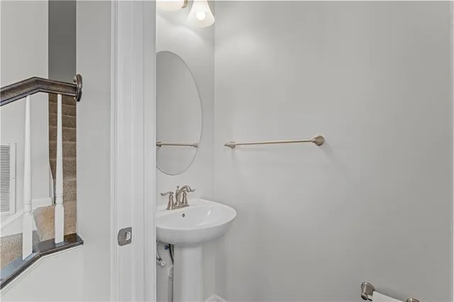 a bathroom with a sink and mirror