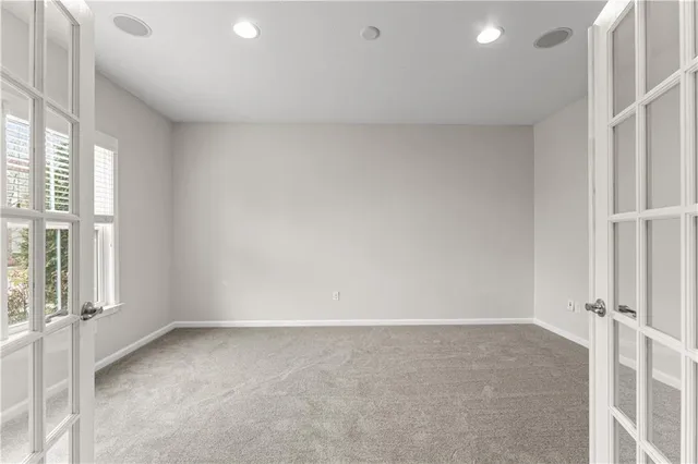 a view of an empty room and a window