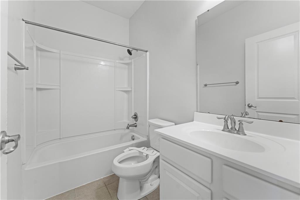 818 Oneida Circle Mars, PA 16046 - Photo 31 of 45 a bathroom with a sink a toilet a mirror a bathtub and shower