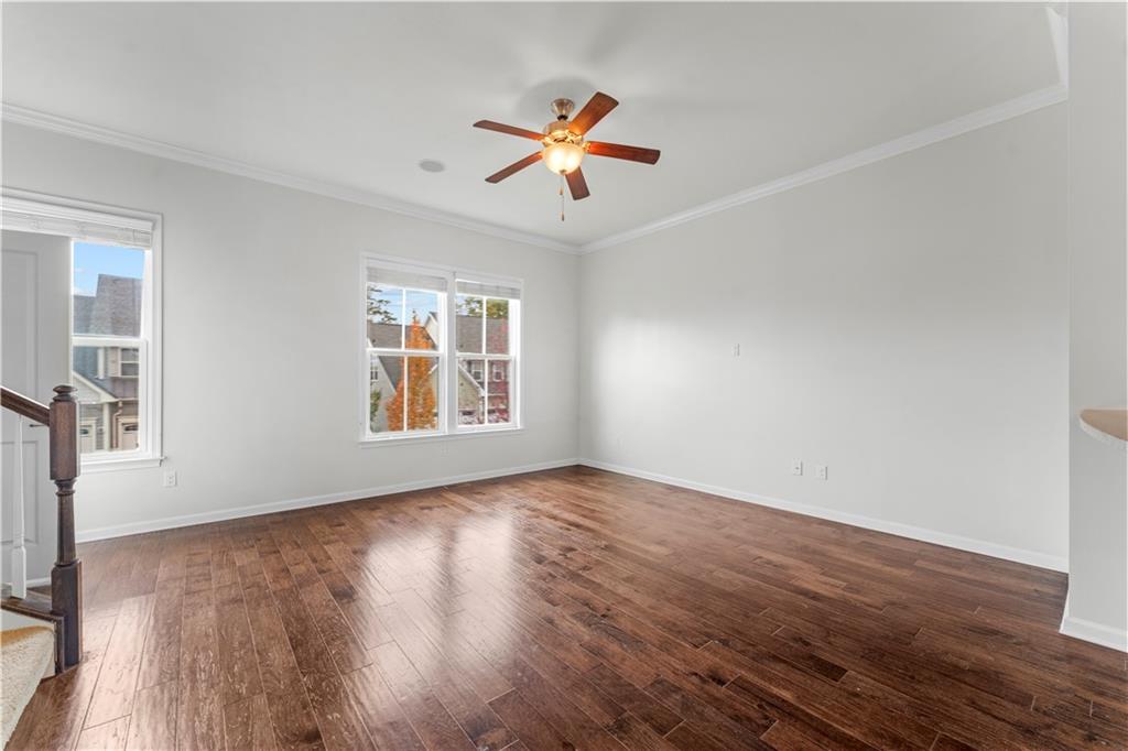 818 Oneida Circle Mars, PA 16046 - Photo 9 of 45 a view of an empty room with wooden floor and a window