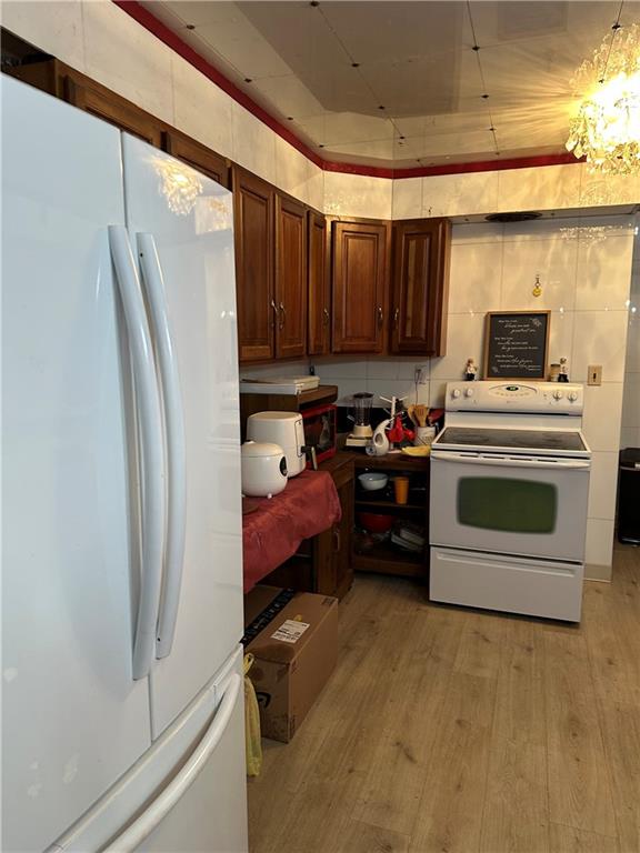 1730 Graham Boulevard Pittsburgh, PA 15235 - Photo 3 of 24 a kitchen with a refrigerator and a stove