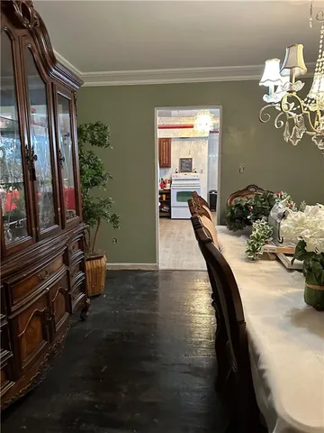 a dining room with furniture and wooden floor