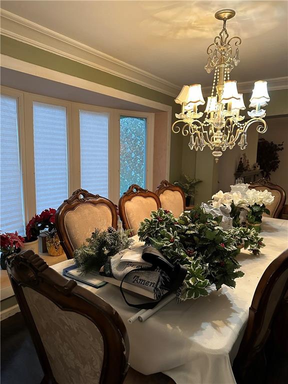1730 Graham Boulevard Pittsburgh, PA 15235 - Photo 9 of 24 a table with a flower pot and a chandelier