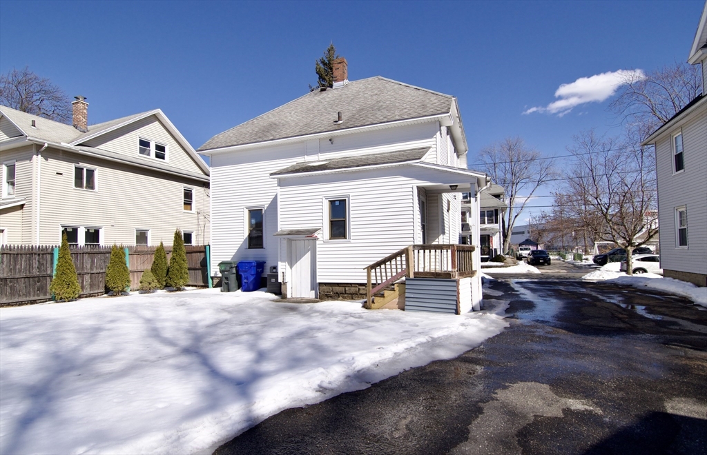 30 Duryea Street Springfield, MA 01104 - Photo 3 of 42 a view of a house with a snow in the background