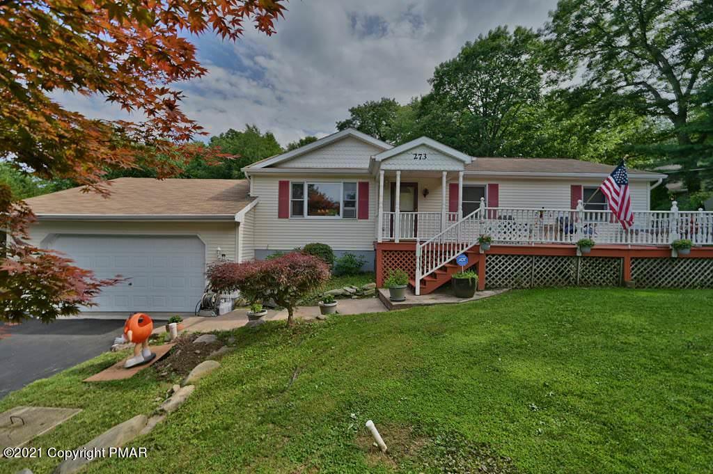 273 Devils Hole Road Cresco, PA 18326 - Photo 1 of 59 a front view of a house with a yard and porch