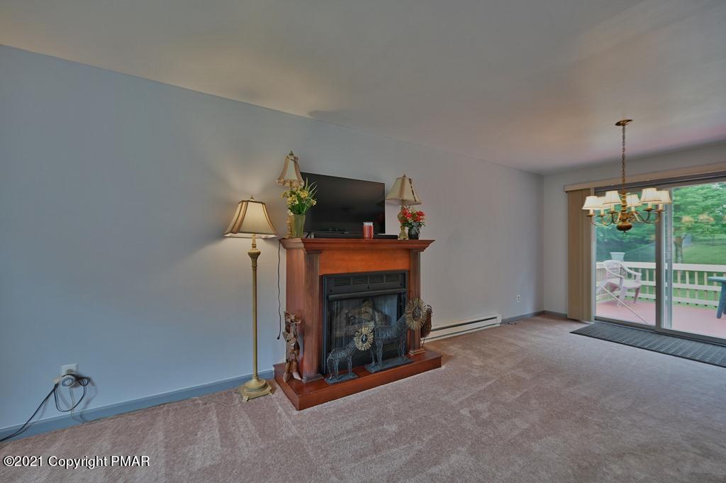 273 Devils Hole Road Cresco, PA 18326 - Photo 14 of 59 a living room with furniture and a fireplace