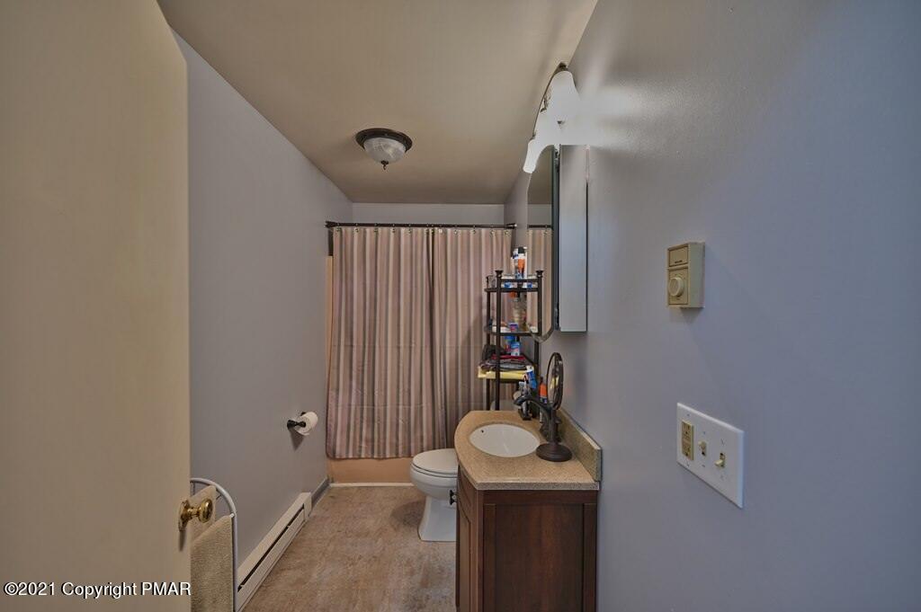 273 Devils Hole Road Cresco, PA 18326 - Photo 28 of 59 a bathroom with a sink and mirror
