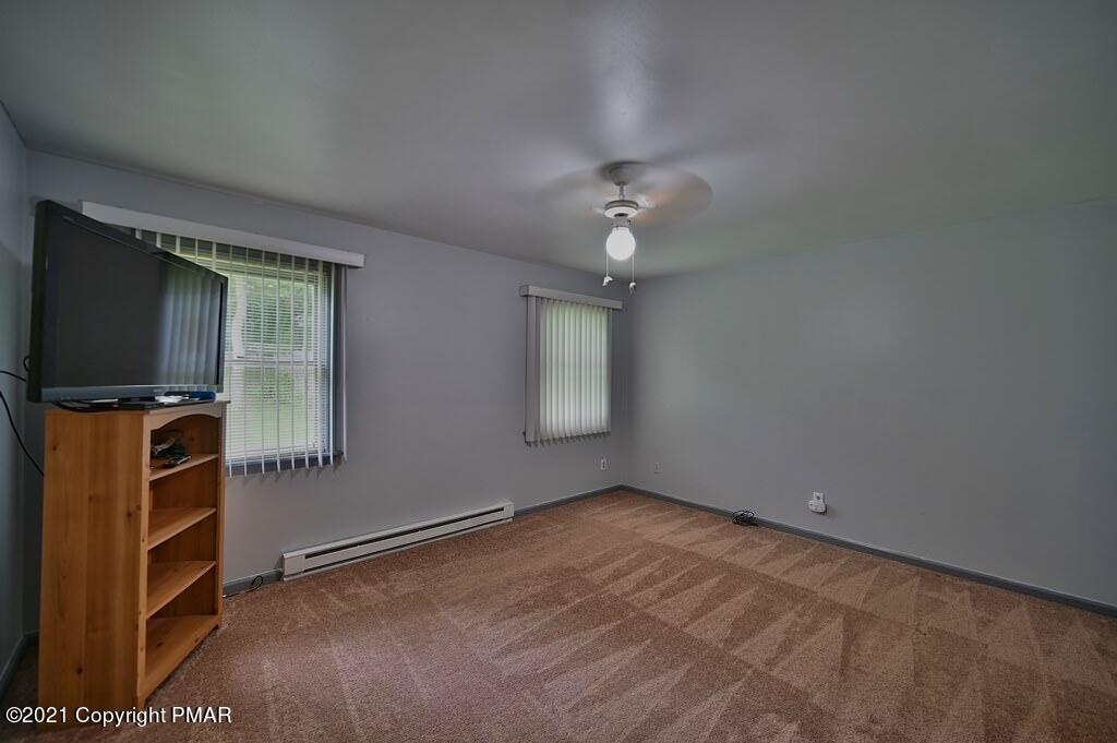 273 Devils Hole Road Cresco, PA 18326 - Photo 32 of 59 wooden floor in an empty room with a window