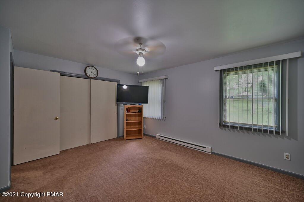 273 Devils Hole Road Cresco, PA 18326 - Photo 33 of 59 an empty room with windows and fan