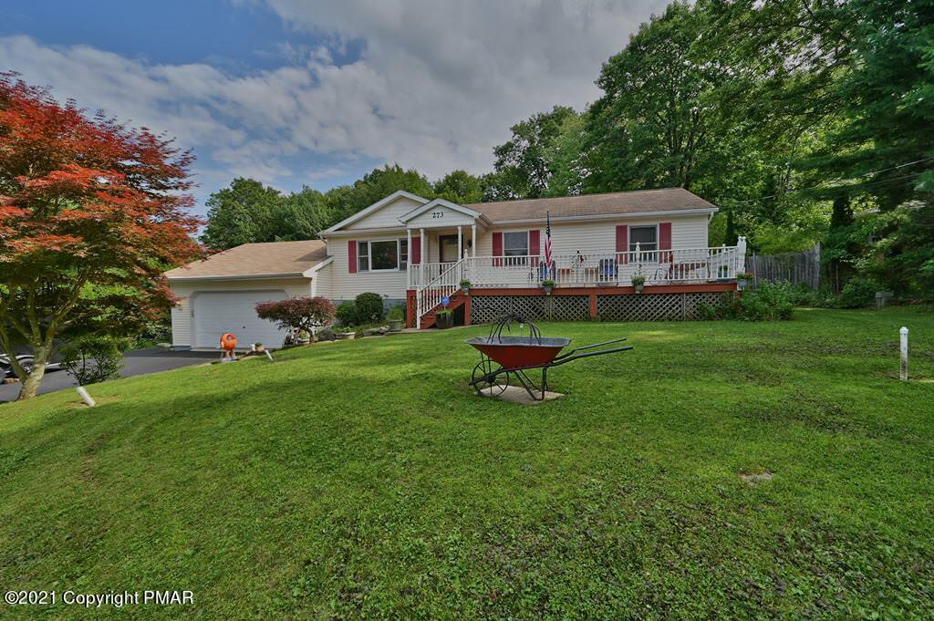 273 Devils Hole Road Cresco, PA 18326 - Photo 46 of 59 a front view of a house with garden