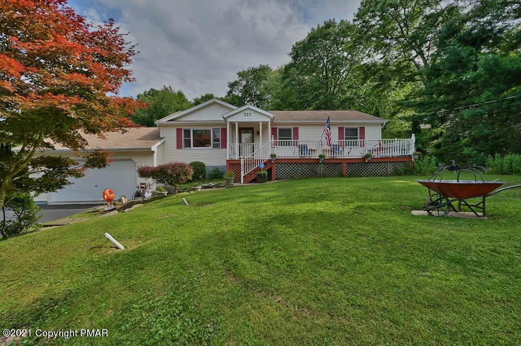 273 Devils Hole Road Cresco, PA 18326 - Photo 47 of 59 a front view of a house with garden