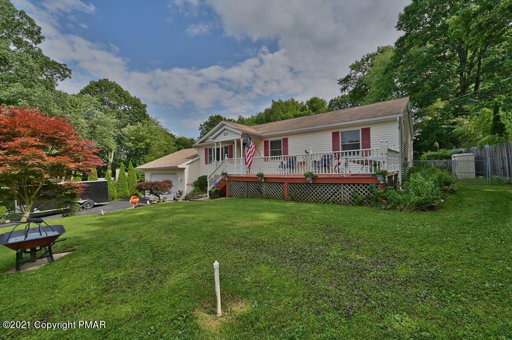 273 Devils Hole Road Cresco, PA 18326 - Photo 49 of 59 a front view of house with yard and outdoor seating