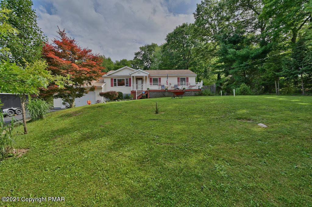 273 Devils Hole Road Cresco, PA 18326 - Photo 50 of 59 a front view of a house with a garden