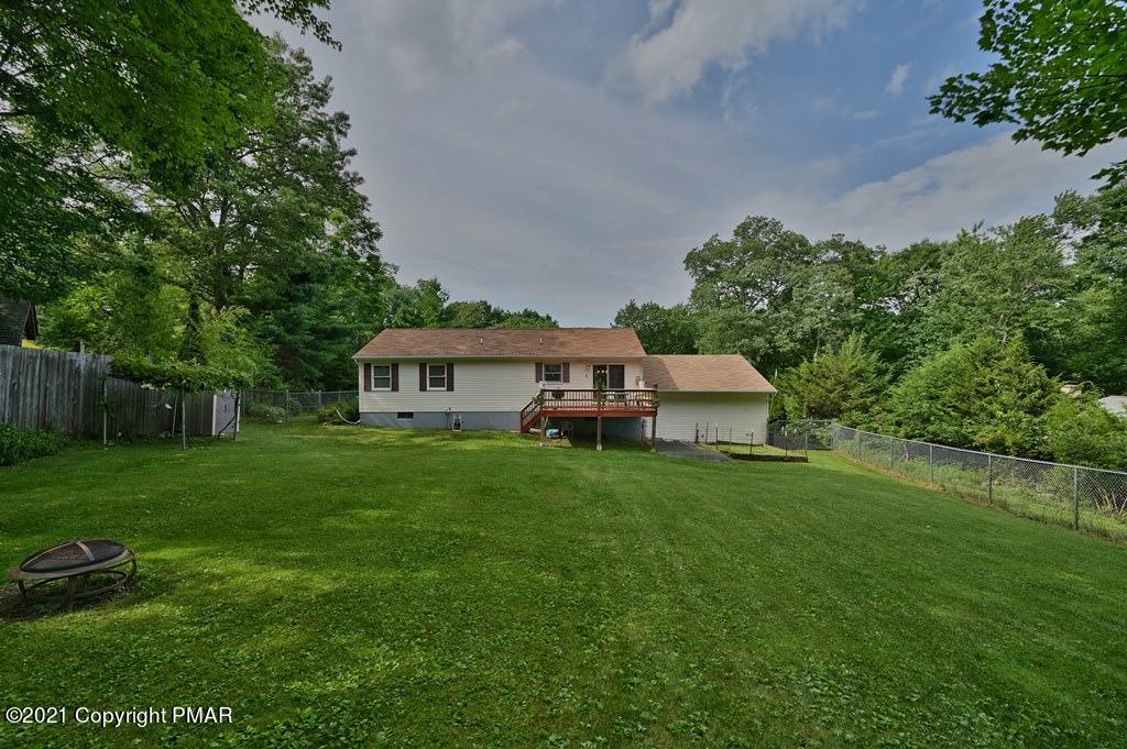 273 Devils Hole Road Cresco, PA 18326 - Photo 54 of 59 a front view of a house with a yard and trees