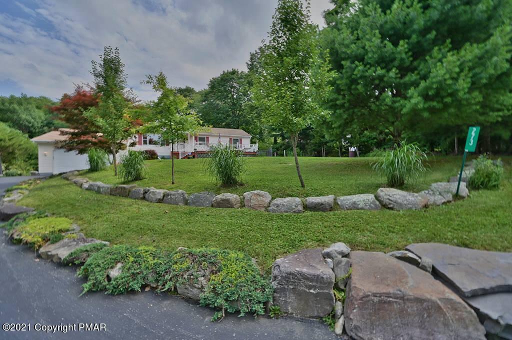 273 Devils Hole Road Cresco, PA 18326 - Photo 57 of 59 a view of a garden with a fountain