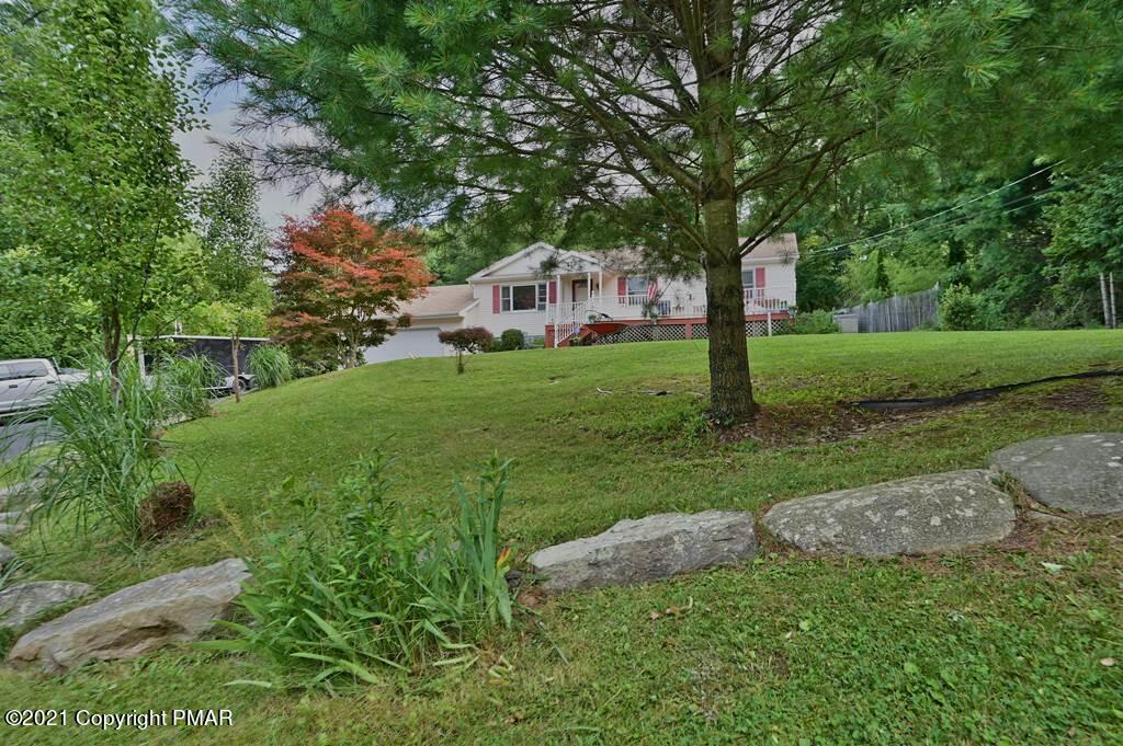 273 Devils Hole Road Cresco, PA 18326 - Photo 58 of 59 a front view of a house with garden