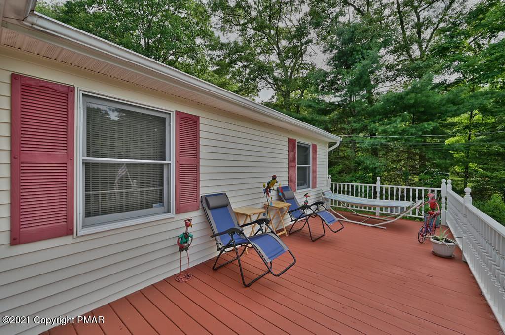 273 Devils Hole Road Cresco, PA 18326 - Photo 8 of 59 a view of a chairs on the roof deck