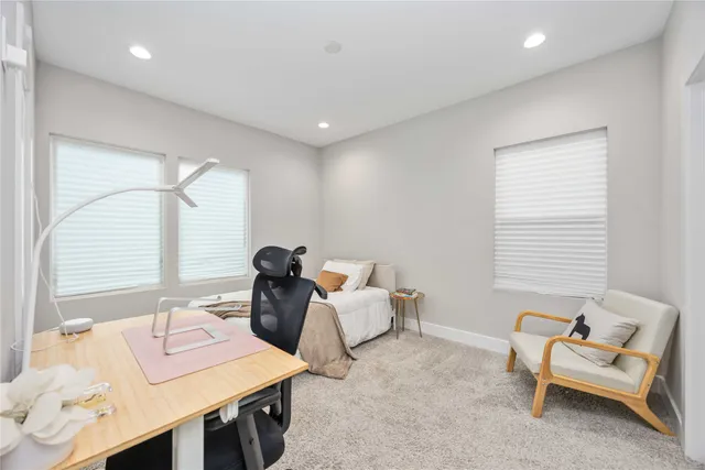 a work room with furniture and window