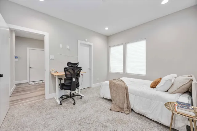 a bedroom with bed and a window