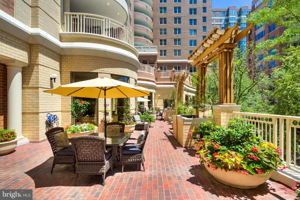 a view of a chairs and table in the patio