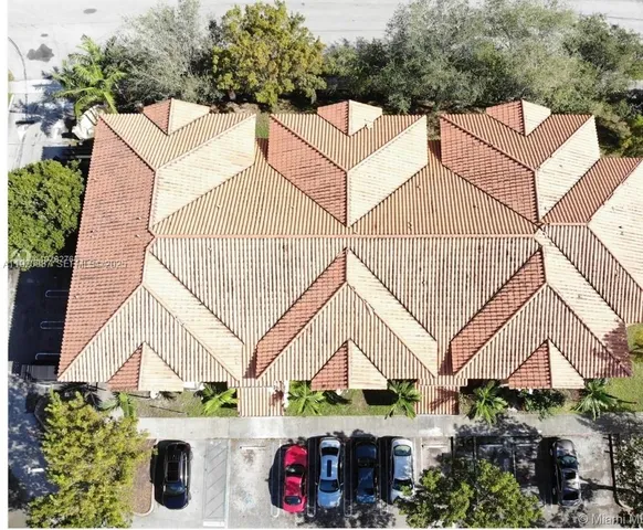 a view of street along with house and trees