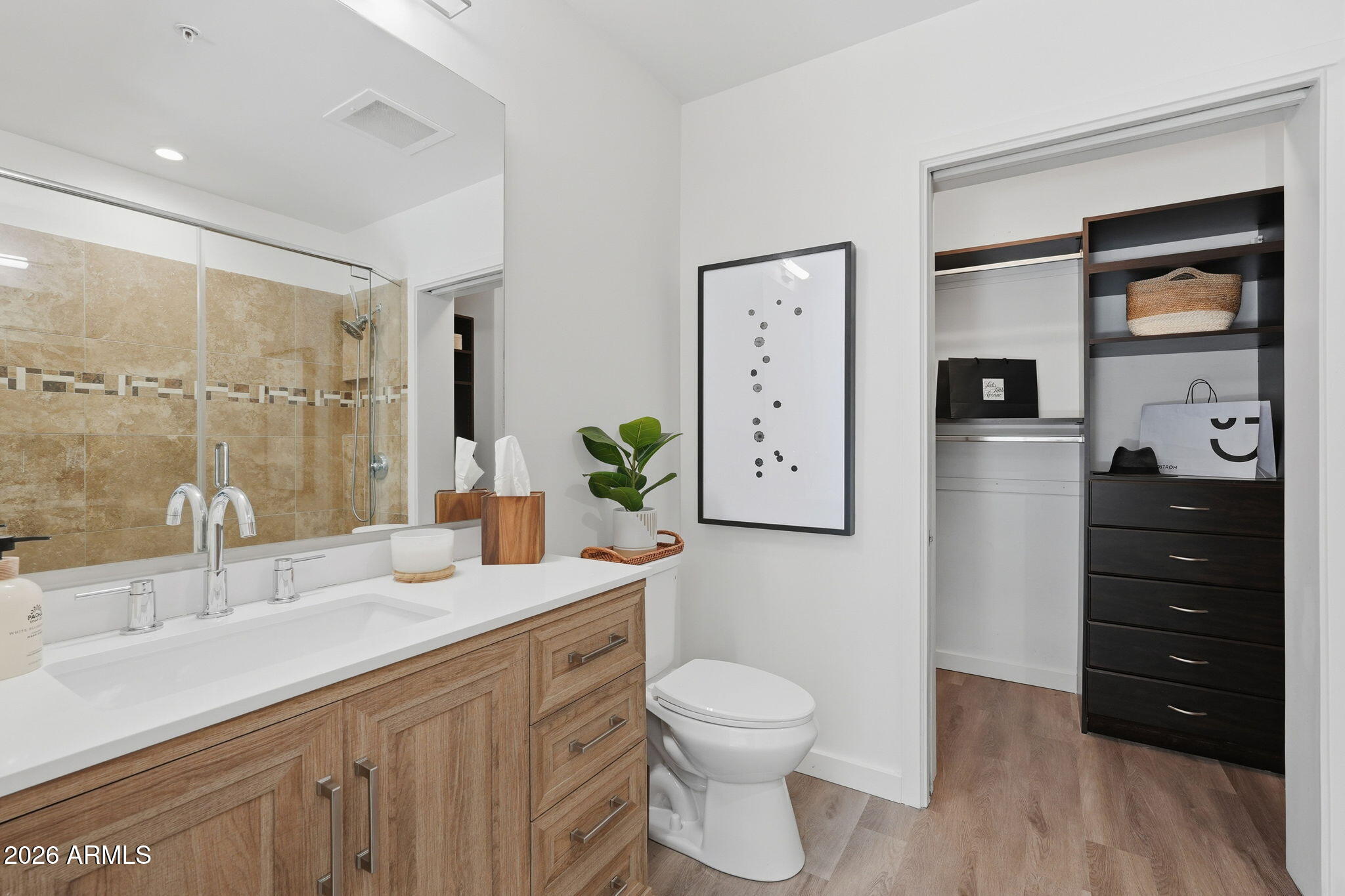 208 West Portland Street, Unit 155 Phoenix, AZ 85003 - Photo 12 of 36 a bathroom with a sink a toilet and shower