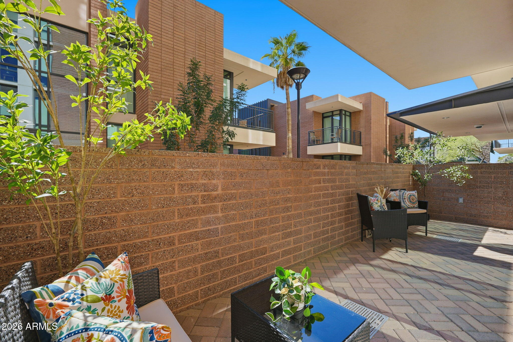 208 West Portland Street, Unit 155 Phoenix, AZ 85003 - Photo 16 of 36 a view of a chairs and table in a patio
