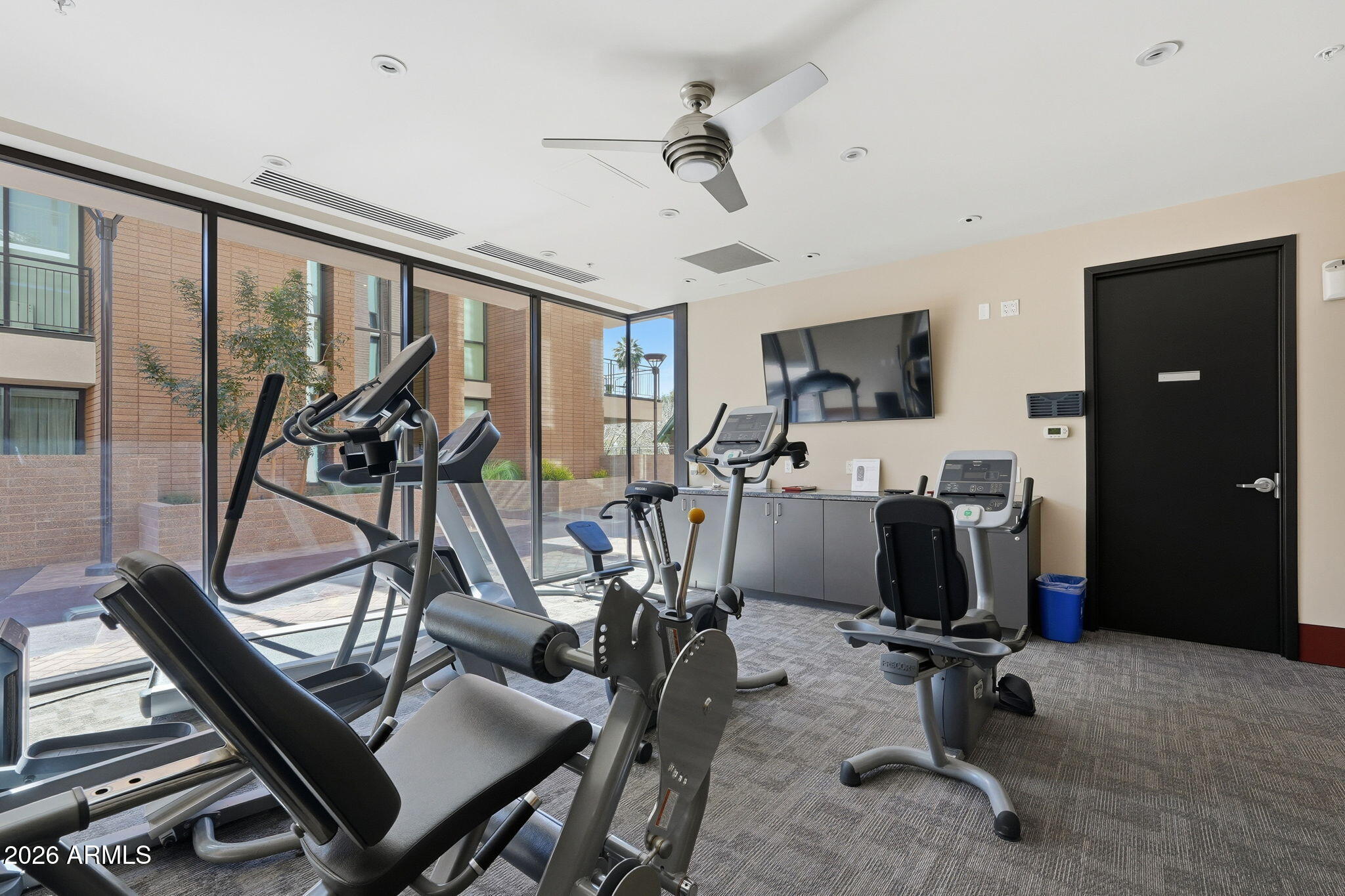 208 West Portland Street, Unit 155 Phoenix, AZ 85003 - Photo 19 of 36 a view of a room with gym equipment