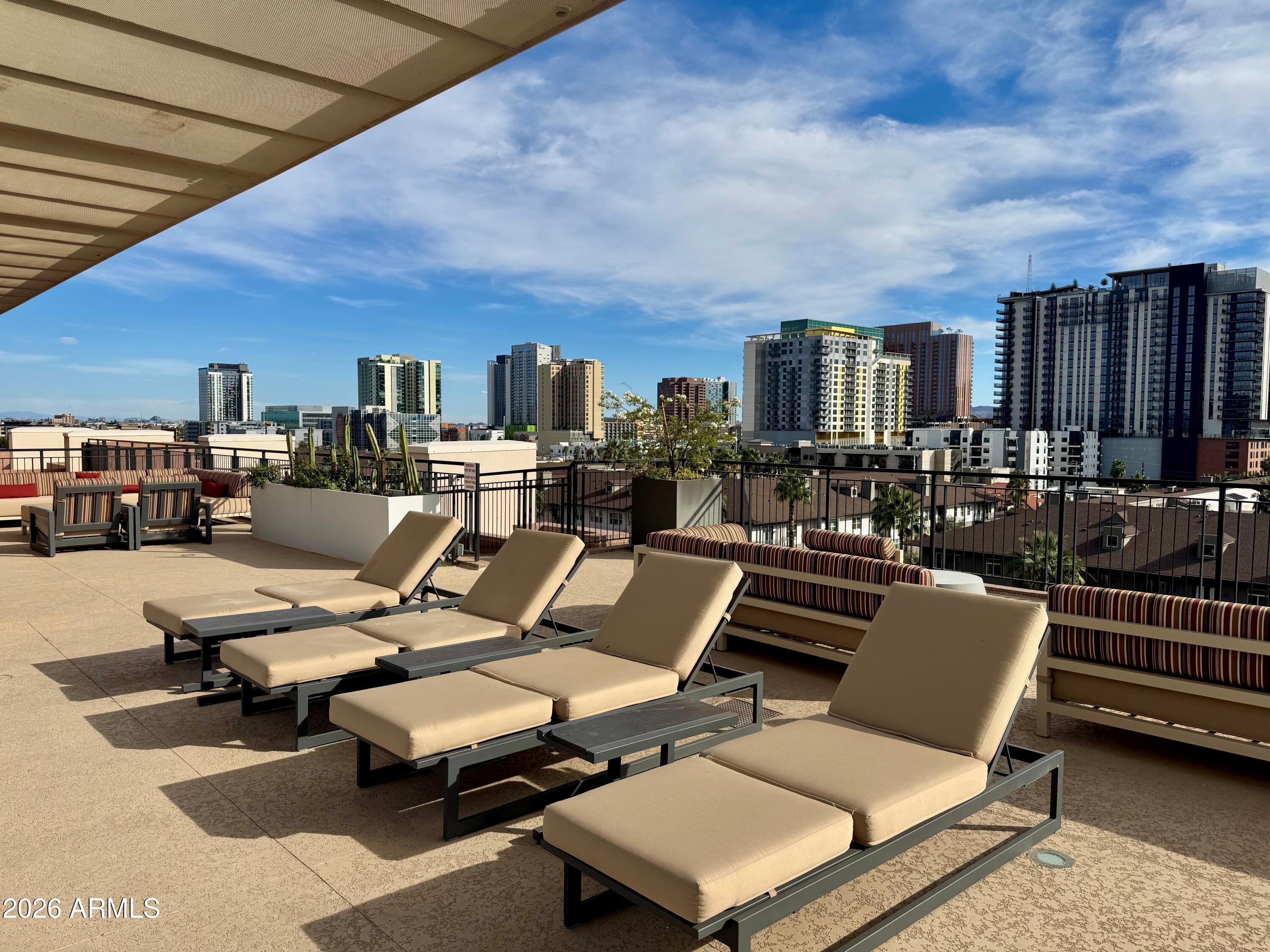 208 West Portland Street, Unit 155 Phoenix, AZ 85003 - Photo 24 of 36 a view of a terrace with furniture