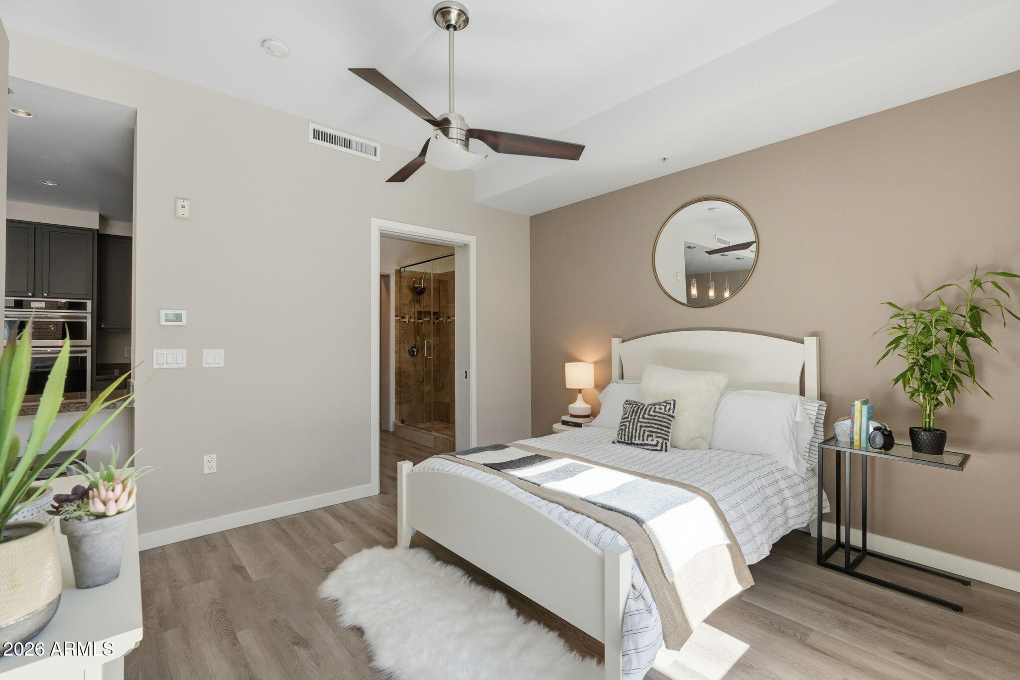 208 West Portland Street, Unit 155 Phoenix, AZ 85003 - Photo 10 of 36 a bedroom with bed and a potted plant