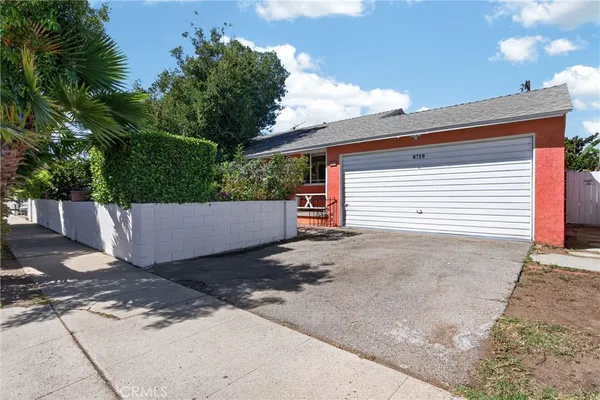 a view of backyard and garage