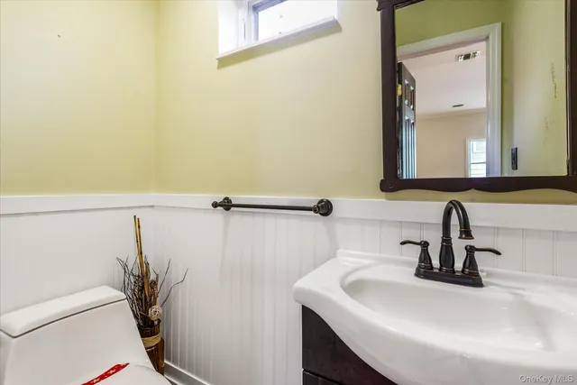 a bathroom with a sink a mirror and a shower