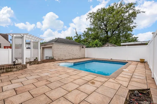 a view of pool and outdoor space