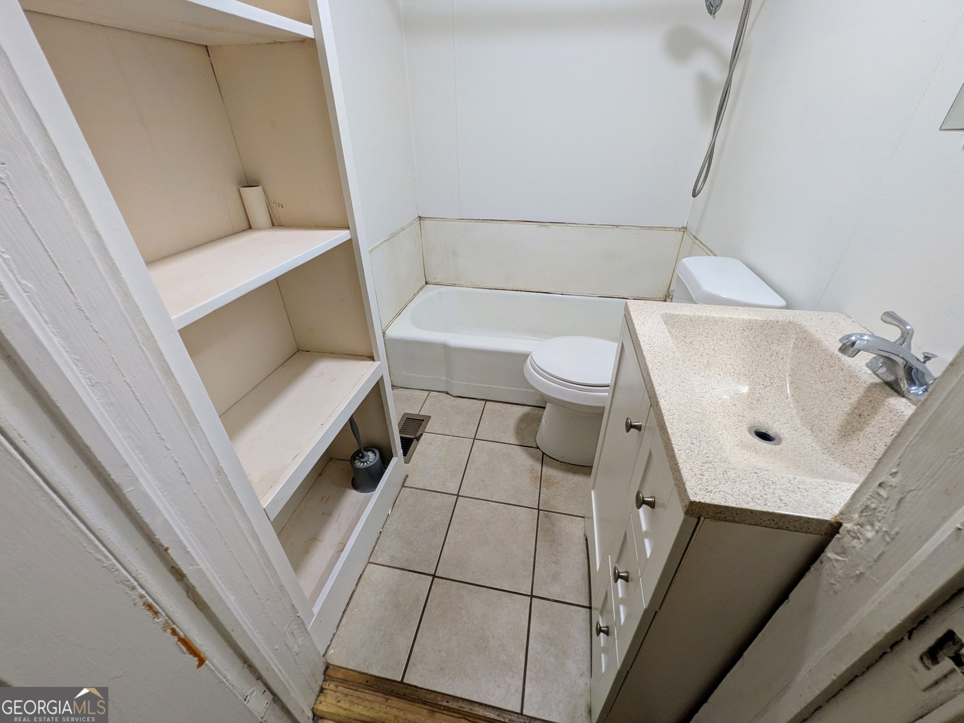 173 Baugh Street Commerce, GA 30529 - Photo 12 of 24 a bathroom with a sink and toilet